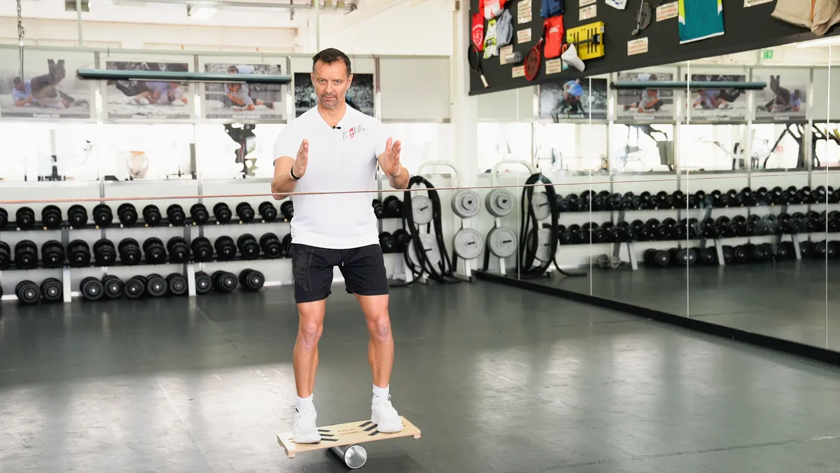 Balance-Board Gleichgewicht halten